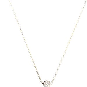 May include: A silver necklace featuring a fine chain and a small, textured pendant. The pendant has a detailed design. The necklace is shown against a white backdrop, emphasizing its understated elegance.