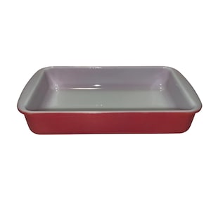 May include: A rectangular baking dish with a red exterior and a light pink and white interior. The dish has rounded corners and a glossy finish. This kitchenware is designed for baking and serving.