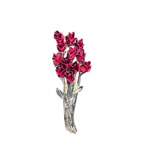May include: A silver-toned brooch featuring a bouquet of red roses. The roses have a detailed texture and are clustered together, with a silver stem and leaves. The brooch is designed to be worn as an accessory.