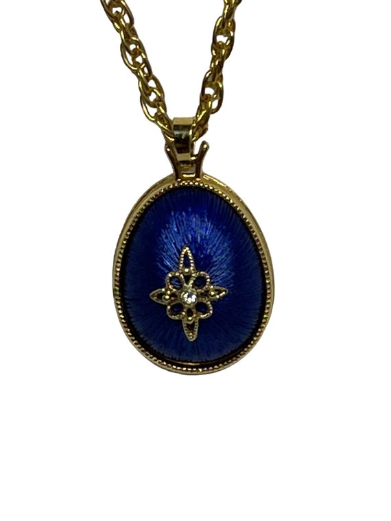 Avon Gold Tone Necklace With Blue Enamel and Rhinestone Egg