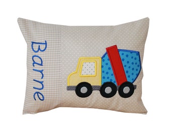 Cuddly pillow with construction vehicle and desired names