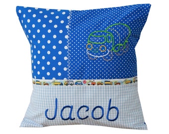 Cuddly pillow with construction vehicle and desired name