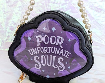 May include: A black purse shaped like a seashell with a purple and white design that says "Poor Unfortunate Souls". The purse has a pearl chain strap.