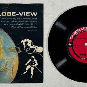 May include: A black vinyl record with a red label that says "Columbia Special Products" and "Globe-View". The record is a promotional item for Rand McNally's World Portrait Globe.
