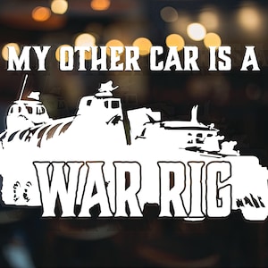May include: White vinyl sticker with the text "My other car is a WAR-RIG" and a silhouette of a military vehicle.