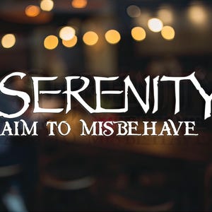 May include: White text on a black background reads "Serenity I aim to misbehave".