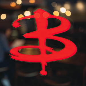 May include: A red stylized symbol of a letter B, with a pointed bottom, on a dark background.