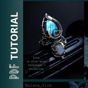 May include: A wire-wrapped ring featuring a large, pear-shaped blue labradorite stone and a smaller, round moonstone. The metalwork includes intricate silver wire coils and soldered elements. Text on the image reads: PDF TUTORIAL, Ring in wire wrap technique + soldering, @alana_fire.