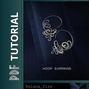 May include: A pair of hoop earrings with a silver and gold design. The earrings have a swirling, abstract pattern. The image also includes the text "PDF TUTORIAL" and "HOOP EARRINGS". The earrings are displayed on a dark blue background.