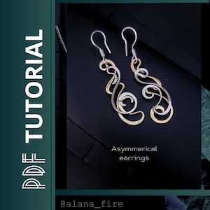 May include: A pair of asymmetrical earrings with silver and gold-toned metal. The earrings have a unique, flowing design with curved lines and swirls. The image also includes the text "PDF TUTORIAL" and "Asymmetrical earrings".