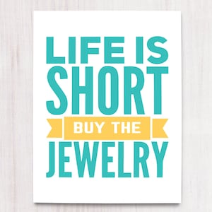 May include: A teal blue and yellow graphic print with the text "Life is short, buy the jewelry".