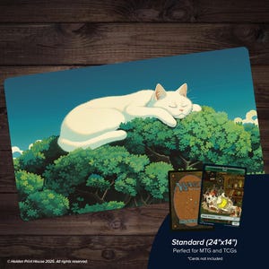 May include: A blue and green playmat featuring a white cat sleeping on a green bush under a blue sky. The playmat is labeled "Standard (24"x14")" and is designed for MTG and TCGs. The image also includes two trading cards.