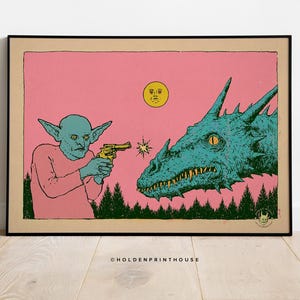 May include: A framed art print on a tan background features a pink sky over a dark green forest. A blue goblin points a yellow revolver at a large blue dragon head. A yellow sun with a face is in the sky. The text HOLDENPRINTHOUSE is at the bottom.