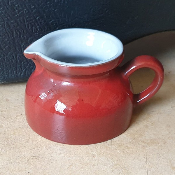 Fohr Keramik 505/4-5, fine red West-Germany pottery ceramic creamer with one drop of milky glaze spilling over the monochrome body