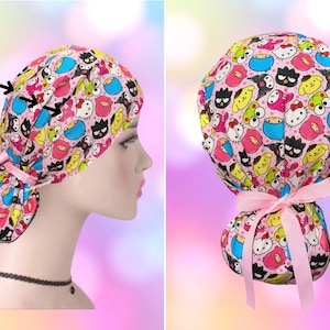 May include: A pink scrub cap featuring a colorful pattern of various Sanrio characters including Hello Kitty, Pompompurin, and Keroppi. The cap includes a light pink ribbon tie at the back and text that reads Add buttons with arrows pointing to the side.