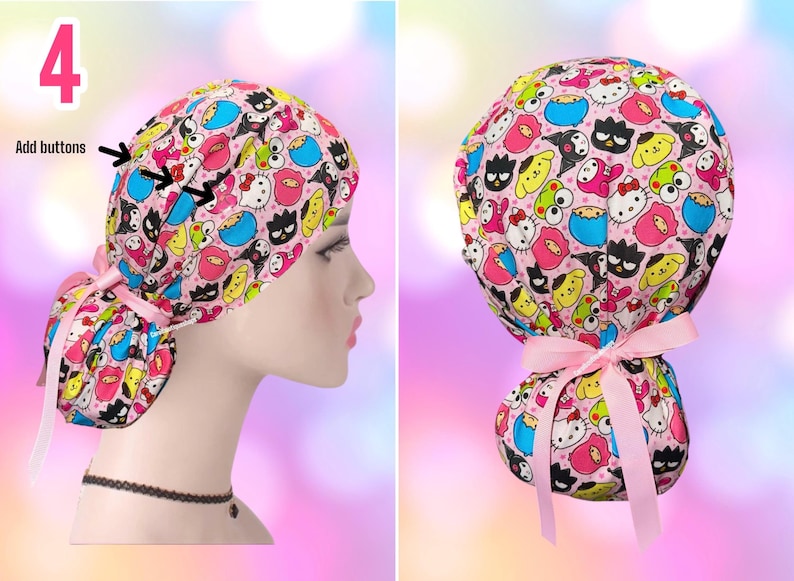 May include: A pink scrub cap featuring a colorful pattern of various Sanrio characters including Hello Kitty, Pompompurin, and Keroppi. The cap includes a light pink ribbon tie at the back and text that reads Add buttons with arrows pointing to the side.