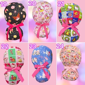 May include: Six scrub caps with ponytail pouches and pink ribbons. Number 19 is black with pastries. Number 20 is pink with Sanrio characters. Number 21 is a Christmas plaid with Hello Kitty. Number 22 is a Christmas grid. Number 23 is blue with winter scenes. Number 24 is peach with My Melody.