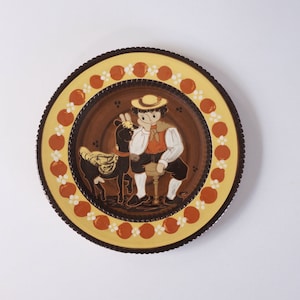 1950s ceramic wall hanging / plate. Kohler Biel Switzerland 310 -24. Swiss art pottery, signed F. Hand painted boy and goat, fine folk style