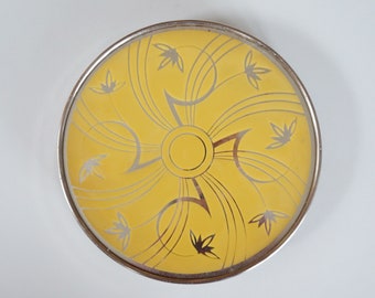 Rotating 1940/1950 yellow cake / food platter, presentation plate. Abstract space age sun and flower decor. Vintage West Germany. Metal base