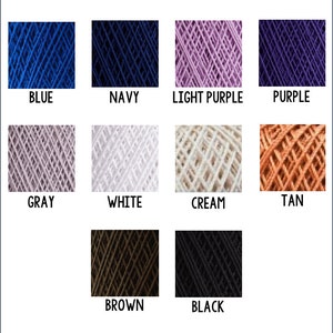 May include: A collection of yarn balls in various colors, including blue, navy, light purple, purple, gray, white, cream, tan, brown, and black.