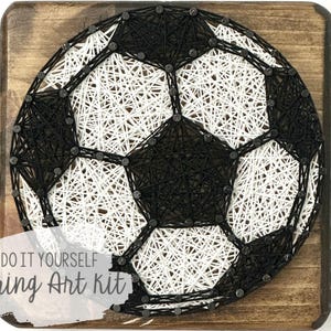 May include: DIY string art kit featuring a black and white football design. The kit includes all the materials needed to create the artwork, including a wooden base, nails, and string.