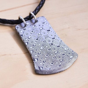 Damasteel Axe Shaped Pendant with a Braided Black Leather Cord and a Sterling Silver Clasp, Damasteel Rose Pattern, Damascus Steel Pendant