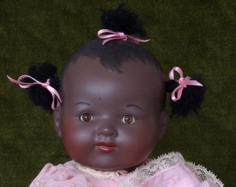 Pretty in Pink: a beautiful girl doll in a pink smocked dress