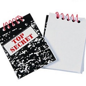 May include: Two small spiral notebooks. One notebook has a black and white patterned cover with the words "TOP SECRET" in red letters. The other notebook has a plain white cover.