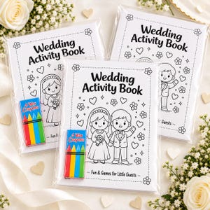 May include: Three wedding activity books in clear plastic packaging, each accompanied by a small box of four wax crayons. The covers feature black and white line art of a bride and groom, floral motifs, hearts, and the text Wedding Activity Book.