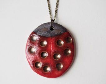 Handmade ceramic ladybird pendant necklace in red gold and black , pottery ladybird necklace, ceramic jewellery gift