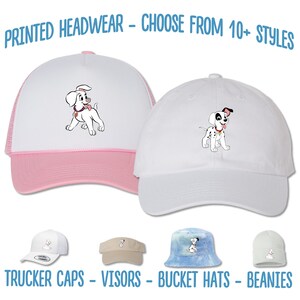 May include: A set of four different styles of hats featuring a cartoon Dalmatian puppy. The hats include a trucker cap, a visor, a bucket hat, and a beanie. The text "PRINTED HEADWEAR - CHOOSE FROM 10+ STYLES" is at the top of the image. The text "TRUCKER CAPS - VISORS - BUCKET HATS - BEANIES" is at the bottom of the image.