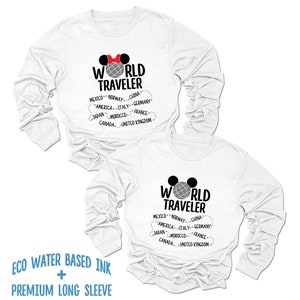 May include: Two white long-sleeve shirts with a gray globe and the text "WORLD TRAVELER" printed on the front. The shirts also feature a red bow and a black Mickey Mouse ear design. The text "MEXICO - NORWAY - CHINA - AMERICA - ITALY - GERMANY - JAPAN - MOROCCO - FRANCE - CANADA - UNITED KINGDOM" is printed below the globe. The shirts are made with eco-friendly water-based ink and premium long sleeves.