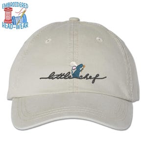 May include: A beige baseball cap with an embroidered image of a mouse wearing a chef's hat and holding a spoon. The text "little chef" is embroidered below the mouse.