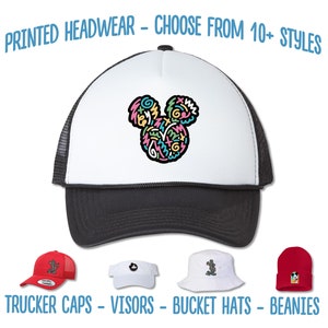 May include: A variety of printed headwear including trucker caps, visors, bucket hats, and beanies. The headwear features a colorful, abstract design of Mickey Mouse's ears.