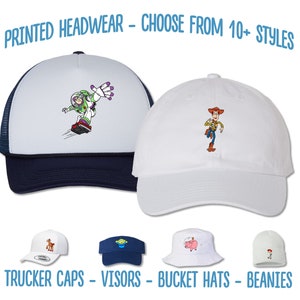 May include: A selection of printed headwear featuring characters from the Toy Story franchise. The headwear includes trucker caps, visors, bucket hats, and beanies. The text "PRINTED HEADWEAR - CHOOSE FROM 10+ STYLES" and "TRUCKER CAPS - VISORS - BUCKET HATS - BEANIES" is displayed below the hats.