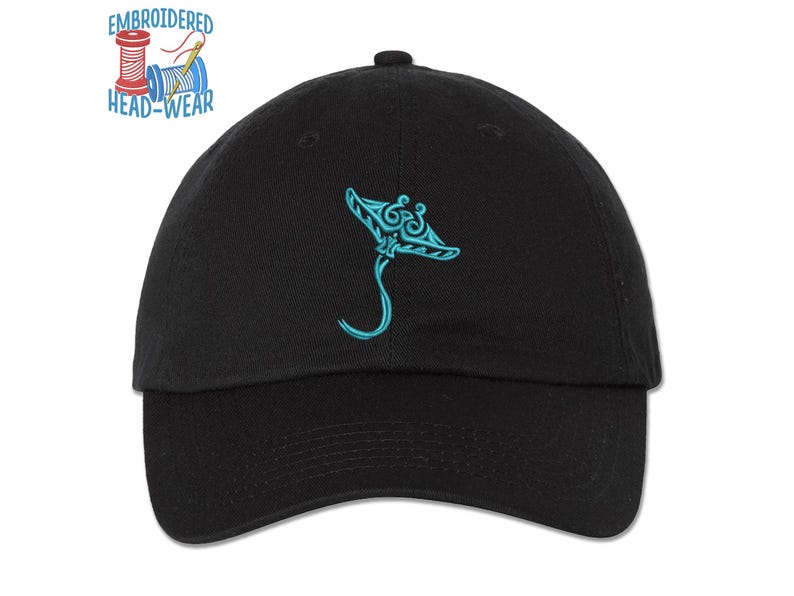 May include: Black baseball cap with an embroidered blue manta ray design. The cap has a curved brim and an adjustable strap.