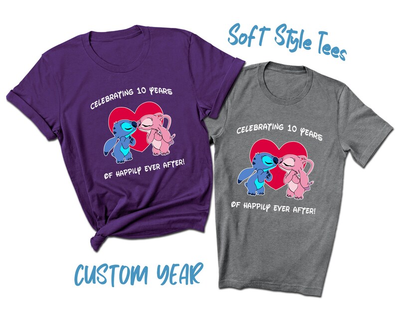 May include: Two soft style t-shirts with a blue and pink cartoon couple kissing in front of a red heart. The text on the shirts reads "Celebrating 10 years of happily ever after!"