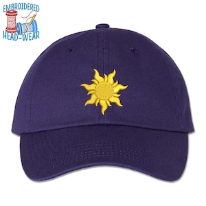 May include: A navy blue baseball cap with an embroidered yellow sun with rays. The cap has a curved brim and an adjustable strap.