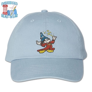 May include: Light blue baseball cap with an embroidered image of Mickey Mouse dressed as a wizard, holding a wand and surrounded by stars.