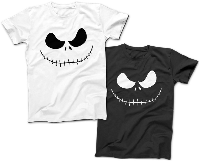 May include: Two t-shirts featuring a black and white graphic of Jack Skellington's face from The Nightmare Before Christmas. One shirt is white and the other is black.