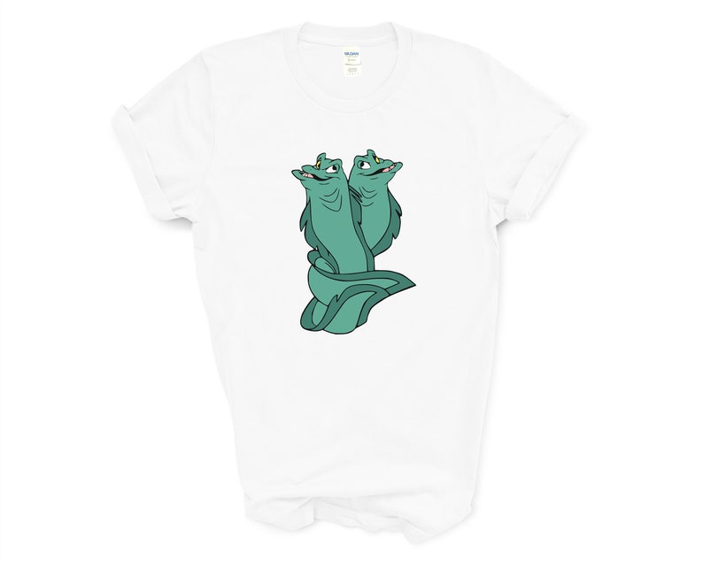 May include: White t-shirt with a green cartoon image of two eels with their heads facing different directions.