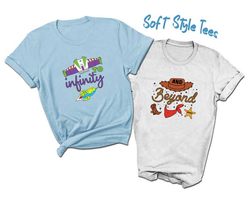 May include: Two t-shirts with cartoon graphics. One is light blue with a Buzz Lightyear design and the words "to infinity". The other is white with a cowboy hat, boots, and the words "and beyond". The text "Soft Style Tees" is above the shirts.