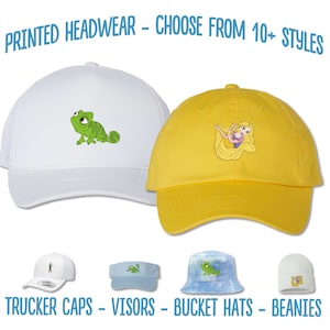 May include: A selection of printed headwear, including trucker caps, visors, bucket hats, and beanies. The headwear features various cartoon characters, including a chameleon and a princess with long hair.