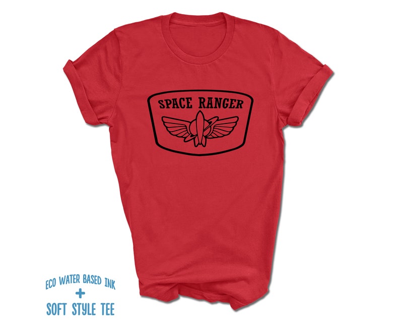 May include: Red t-shirt with a black graphic of a space ranger logo. The logo says "Space Ranger" and features a rocket ship with wings.