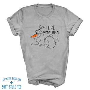 May include: Gray t-shirt with a black and white illustration of Olaf from Frozen. The text "I like warm hugs" is printed on the shirt.