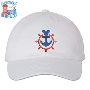 May include: White baseball cap with an embroidered red anchor and steering wheel with a blue Mickey Mouse head in the center.