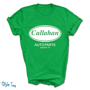 May include: Green t-shirt with a white oval logo that says "Callahan Auto Parts Sandusky, OH".