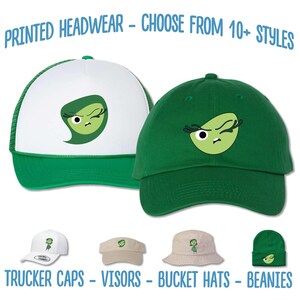 May include: A set of four different styles of hats featuring a green cartoon character with a winking eye and a green and white color scheme. The hats include a trucker cap, a visor, a bucket hat, and a beanie. The text "PRINTED HEADWEAR - CHOOSE FROM 10+ STYLES" is at the top of the image. The text "TRUCKER CAPS - VISORS - BUCKET HATS - BEANIES" is at the bottom of the image.