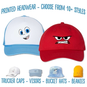 May include: A selection of printed headwear, including trucker caps, visors, bucket hats, and beanies. The headwear features cartoon faces with different expressions.