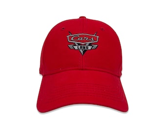 May include: Red baseball cap with an embroidered Cars Land logo in white and gray.